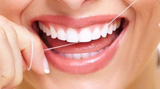 How should dental floss be used?